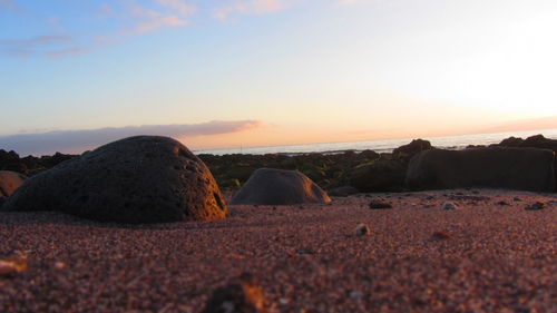 Scenic view of beach at sunset