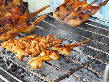 Close-up of meat on barbecue grill