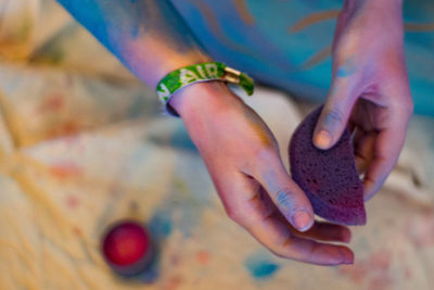 Close-up of hand holding painting