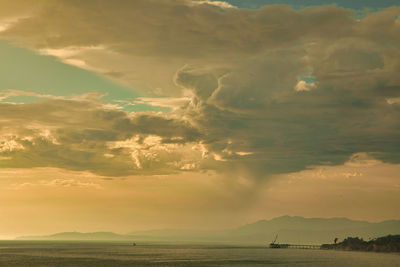 Scenic view of sea against dramatic sky