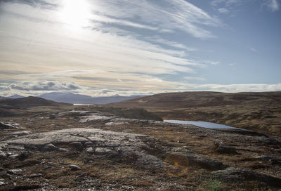 Scenic view of landscape and mountains against sky