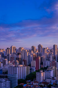 Modern buildings in city against sky