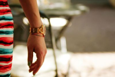 Cropped image of woman wearing wristwatch