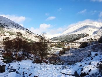 Scenic view of snowcapped mountains against sky