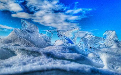 Close-up of glacier against blue sky