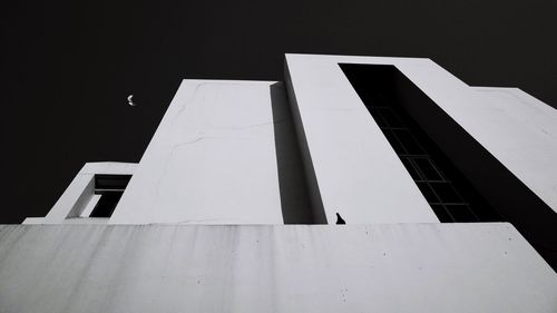 Low angle view of office building against sky