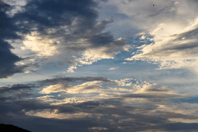 Low angle view of clouds in sky during sunset