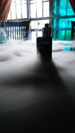 Close-up of glass bottle on table at restaurant