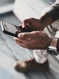 Close-up of man using mobile phone