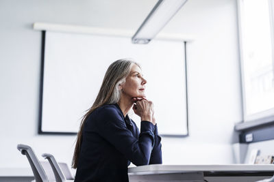 Senior businesswoman in conference room