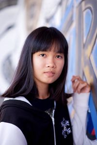 Portrait of smiling girl standing outdoors