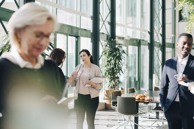 Business people networking at conference in office