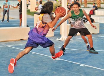 Group of people playing basketball