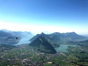 Scenic view of mountains against clear blue sky