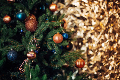 Close-up of christmas ornament hanging on tree