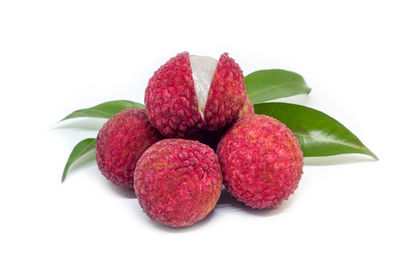 Close-up of lychees on white background