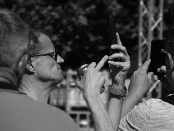 Close-up of man holding cigarette