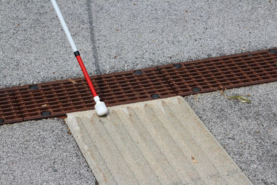 High angle view of bollard on sidewalk