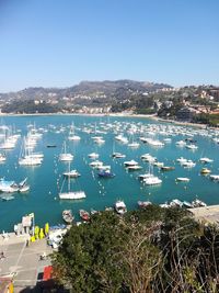 High angle view of boats moored in harbor