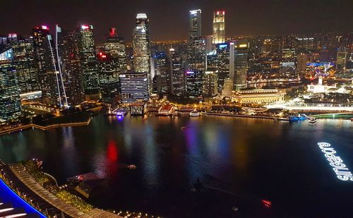 Aerial view of city lit up at night