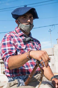 Man looking at bicycle