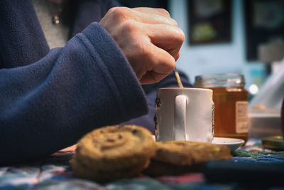 Close-up of hand holding coffee cup