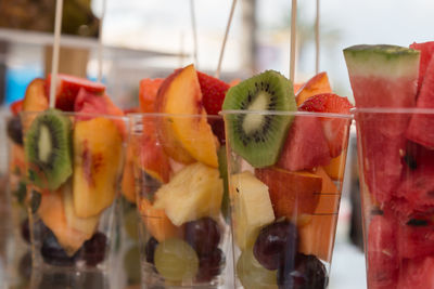 Close-up of chopped fruits in glass
