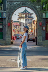 Portrait of woman walking on street