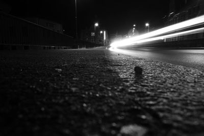 Surface level of light trails on street at night