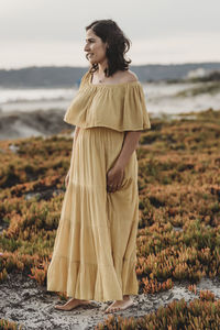 Young woman standing on beach