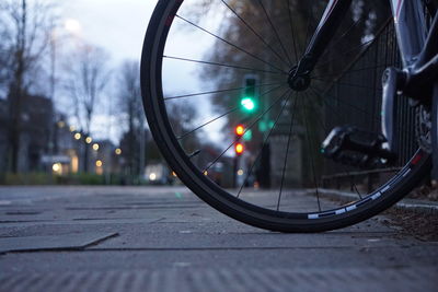 Close-up of bicycle on street