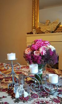 Close-up of flower vase on table at home
