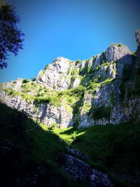 Scenic view of mountains against blue sky