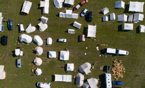 Aerial view of a tent camp and market stalls at a medieval spectacle