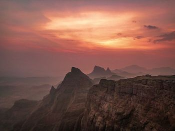 Scenic view of mountains against sky during sunset