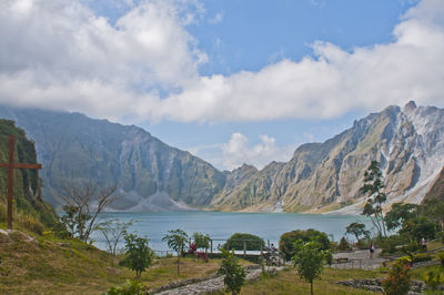 Scenic view of lake and mountains against sky