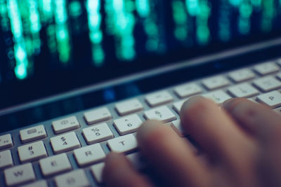 Close-up of hand using computer keyboard