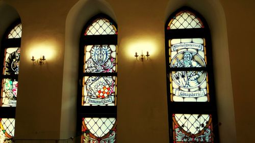 Illuminated building seen through glass window