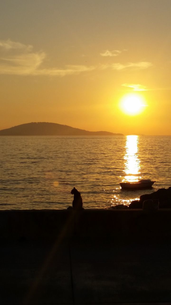 sunset, sea, water, sun, horizon over water, tranquility, tranquil scene, scenics, silhouette, beauty in nature, sky, nature, beach, idyllic, sunlight, reflection, shore, orange color, outdoors, remote