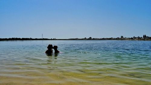 Scenic view of calm sea against clear sky