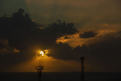 Sunset over the ocean in the village of albion, mauritius.