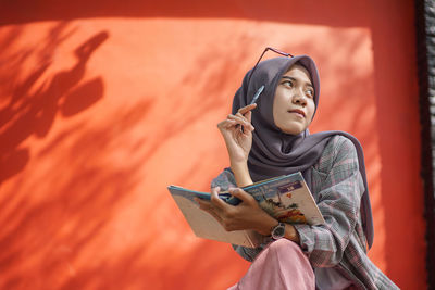 Young woman using mobile phone