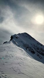 Scenic view of snow covered mountain against sky