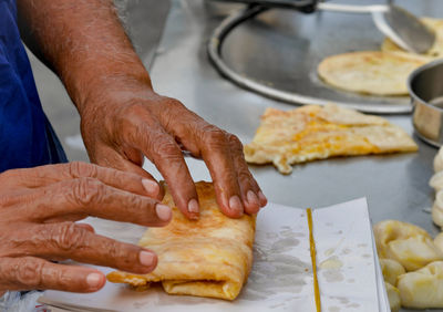 Close-up of man preparing food