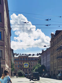 City street and buildings against sky