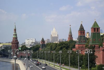 Panoramic view of buildings in city against sky