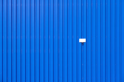 Full frame shot of blue metallic wall