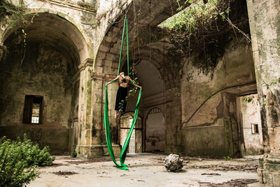 Man standing in abandoned building