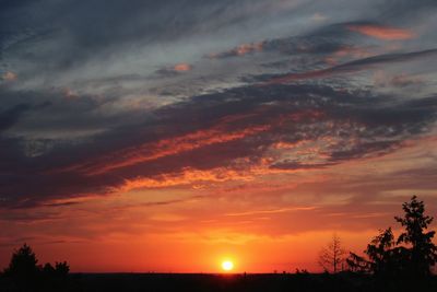 Low angle view of dramatic sky during sunset