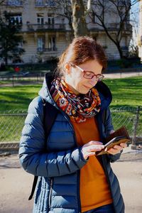 Young woman using smart phone outdoors